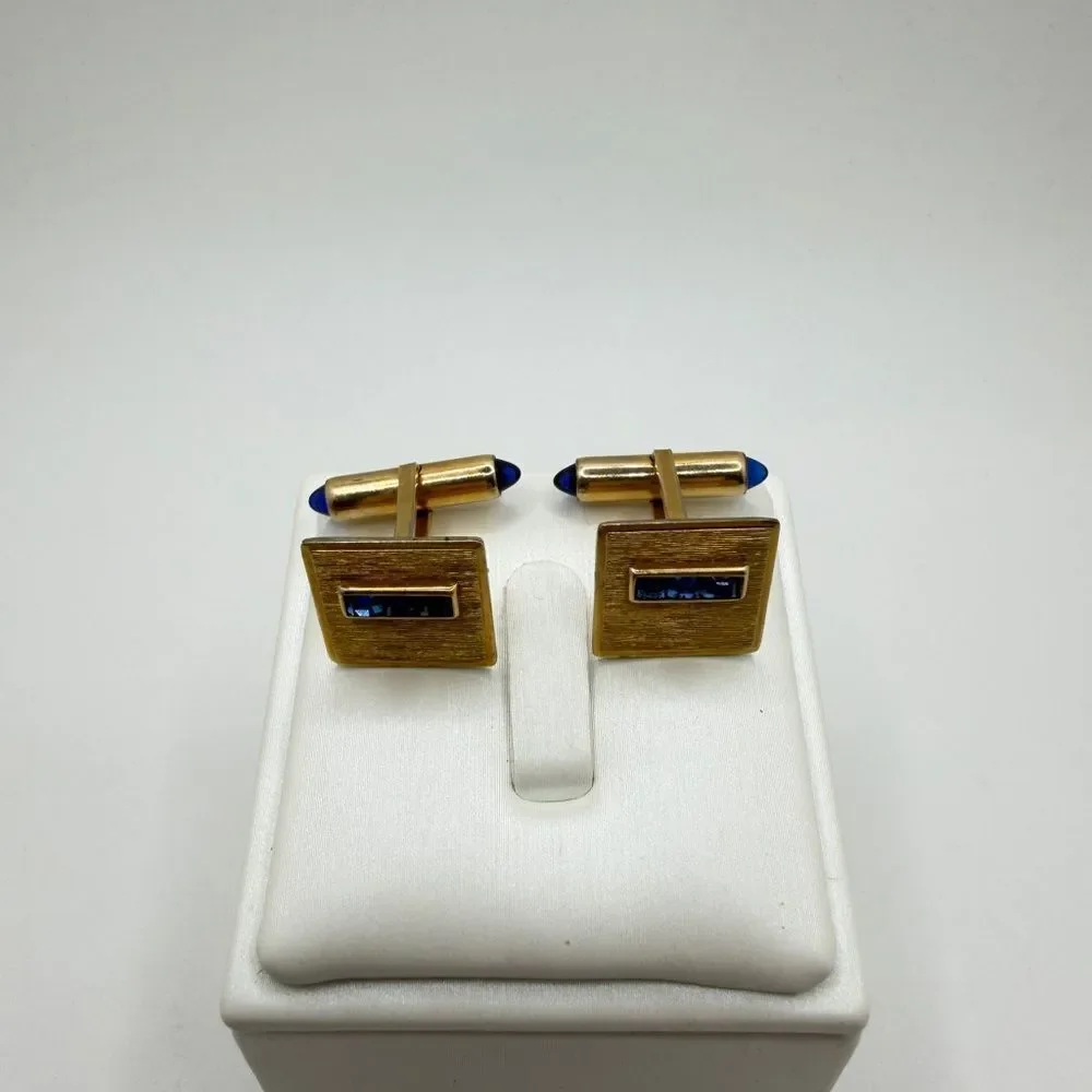 Vintage Krementz Gold tone cuff likes with princess cut blue rhinestone accents!